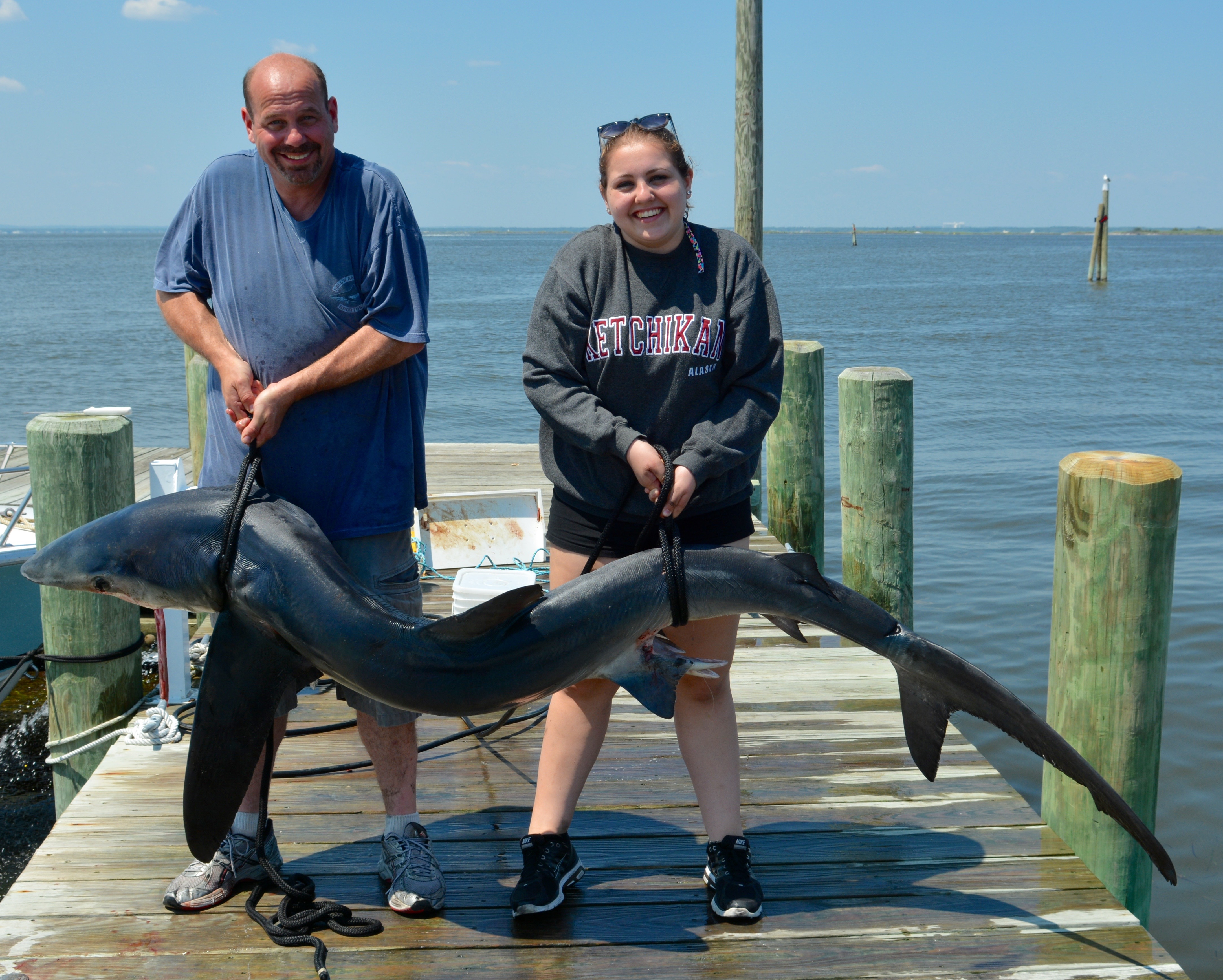 Kevin and Allie Henner lifting their 250 lb. Mako Shark
